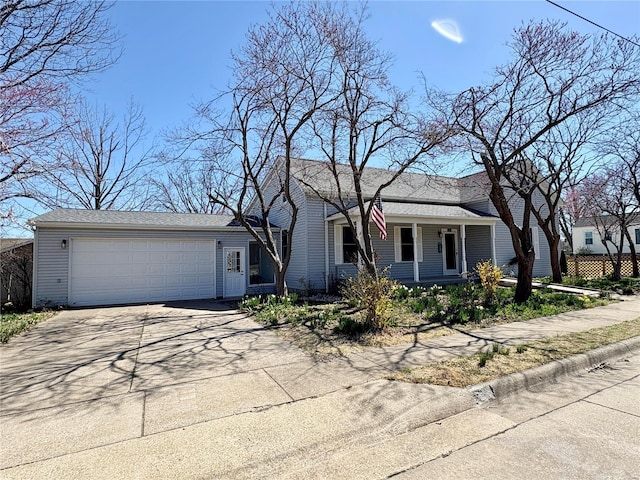 107 S Jackson St, Perryville, MO 63775 - view of front of house featuring concrete driveway, an attached garage, and a porch