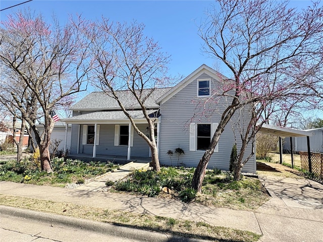 107 S Jackson St, Perryville, MO 63775 - view of front of property featuring a porch, concrete driveway, and a carport