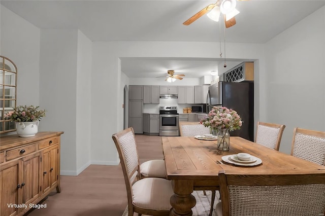 1163 Peace Valley Ln, Hermann, MO 65041 - dining room with a ceiling fan, light wood finished floors, and baseboards