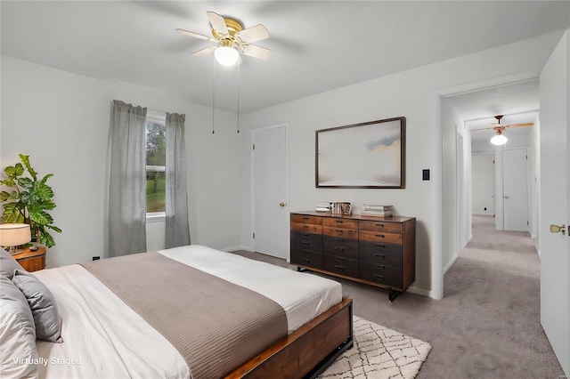 1163 Peace Valley Ln, Hermann, MO 65041 - bedroom with light colored carpet, baseboards, and a ceiling fan