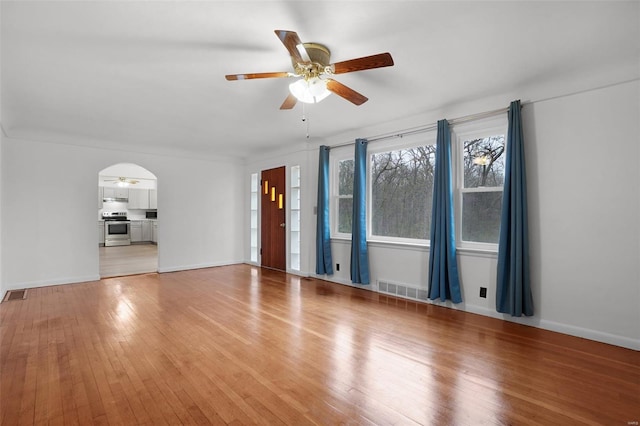 1163 Peace Valley Ln, Hermann, MO 65041 - unfurnished living room with a ceiling fan, light wood-style flooring, and baseboards