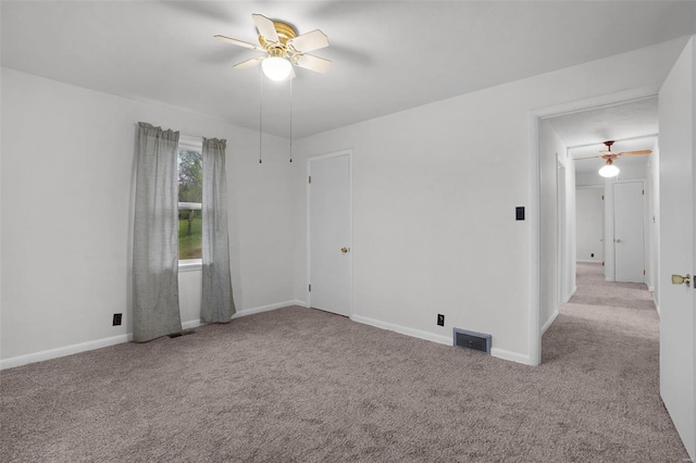 1163 Peace Valley Ln, Hermann, MO 65041 - carpeted empty room featuring a ceiling fan and baseboards