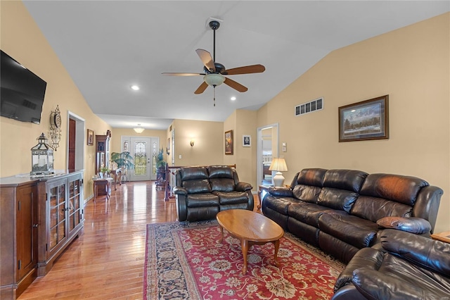 living room with vaulted ceiling, light wood-type flooring, ceiling fan, and recessed lighting