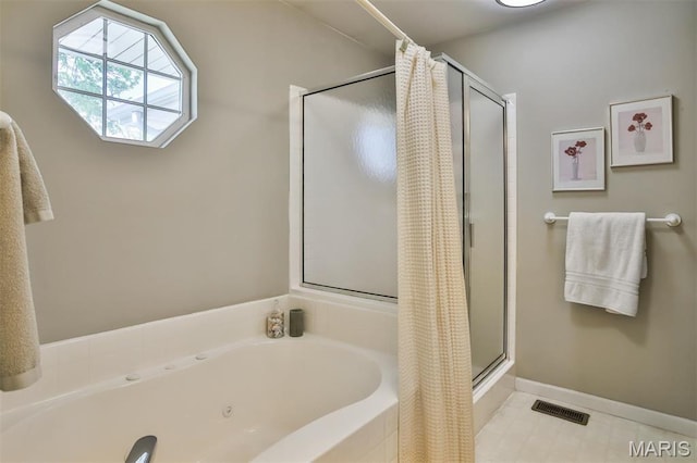 2015 Chapel Hill Xing, Saint Peters, MO 63376 - bathroom featuring a shower stall, a tub with jets, tile patterned flooring, and baseboards
