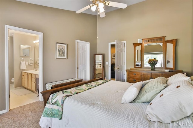 2015 Chapel Hill Xing, Saint Peters, MO 63376 - bedroom featuring a high ceiling, light colored carpet, ceiling fan, and ensuite bathroom