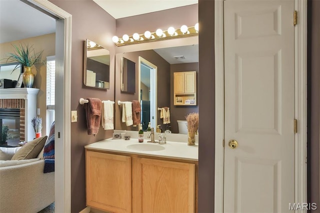 2015 Chapel Hill Xing, Saint Peters, MO 63376 - ensuite bathroom featuring vanity and a brick fireplace