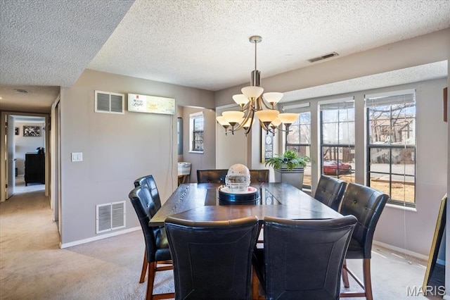 92 Waters Edge Ct Unit 15-2B, Four Seasons, MO 65049 - dining space featuring light colored carpet, a chandelier, a textured ceiling, and baseboards