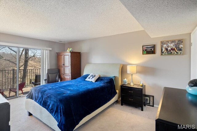 92 Waters Edge Ct Unit 15-2B, Four Seasons, MO 65049 - bedroom featuring access to outside, carpet floors, a textured ceiling, and baseboards
