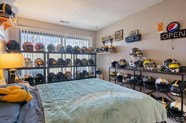 92 Waters Edge Ct Unit 15-2B, Four Seasons, MO 65049 - bedroom with a textured ceiling