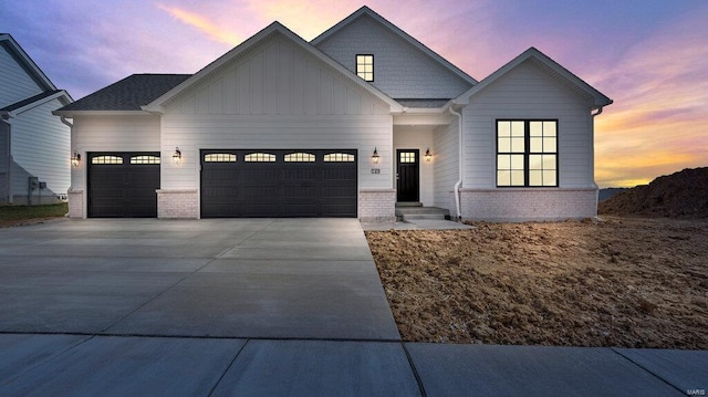 149 Haven Ridge Ct, Dardenne Prairie, MO 63368 - modern inspired farmhouse with an attached garage, board and batten siding, driveway, and brick siding