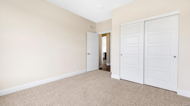 149 Haven Ridge Ct, Dardenne Prairie, MO 63368 - unfurnished bedroom featuring light colored carpet, a closet, and baseboards