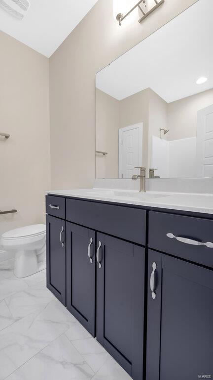 149 Haven Ridge Ct, Dardenne Prairie, MO 63368 - full bathroom with marble finish flooring, vanity, toilet, and a shower