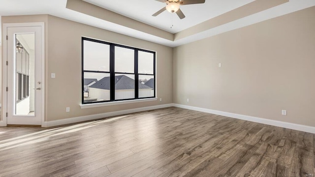 149 Haven Ridge Ct, Dardenne Prairie, MO 63368 - unfurnished room with wood finished floors, baseboards, ceiling fan, and a raised ceiling