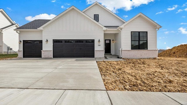 149 Haven Ridge Ct, Dardenne Prairie, MO 63368 - modern inspired farmhouse featuring board and batten siding, a garage, concrete driveway, and brick siding
