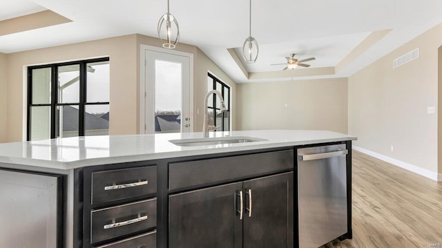 149 Haven Ridge Ct, Dardenne Prairie, MO 63368 - kitchen featuring dishwasher, a sink, light wood-type flooring, baseboards, and a ceiling fan