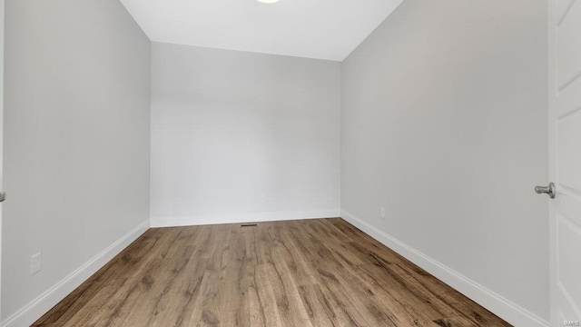 149 Haven Ridge Ct, Dardenne Prairie, MO 63368 - spare room featuring wood finished floors and baseboards