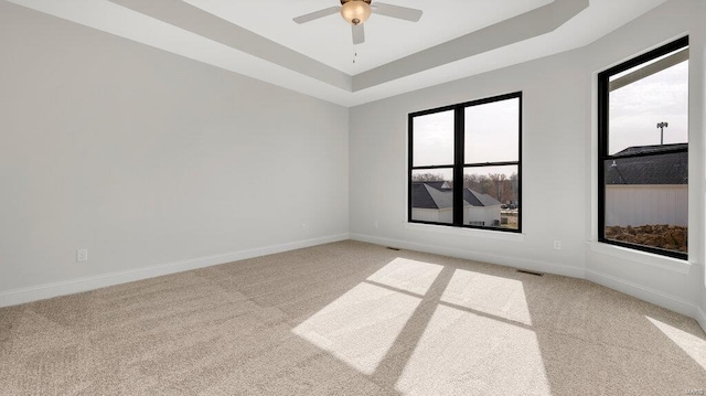 149 Haven Ridge Ct, Dardenne Prairie, MO 63368 - unfurnished room featuring light carpet, a tray ceiling, ceiling fan, and baseboards