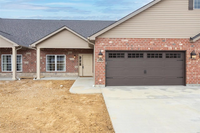 192 Santa Elena Dr, Wentzville, MO 63385 - view of front facade with brick siding, concrete driveway, and a garage