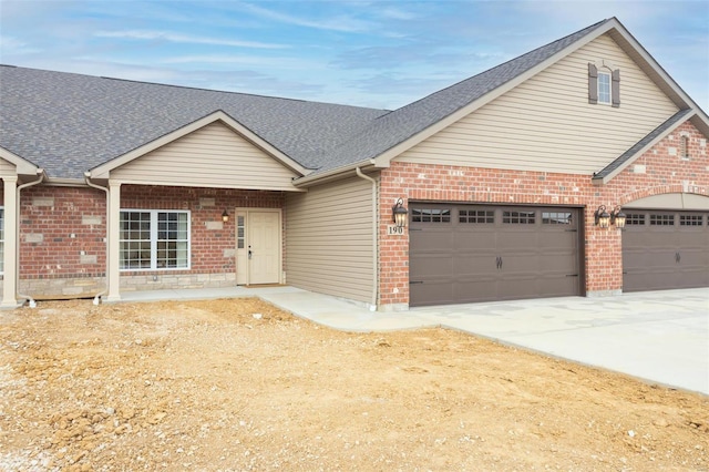 192 Santa Elena Dr, Wentzville, MO 63385 - view of front of property with a garage, driveway, and brick siding