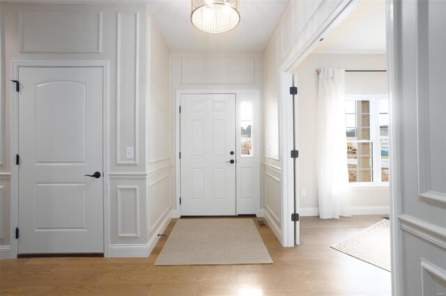 192 Santa Elena Dr, Wentzville, MO 63385 - foyer with light wood-style flooring, a decorative wall, and baseboards