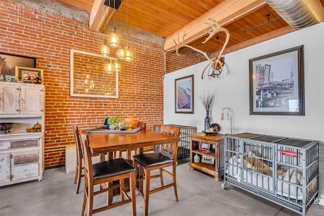 dining room with concrete floors, wooden ceiling, brick wall, and beamed ceiling