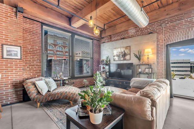 living area with concrete floors, brick wall, wood ceiling, and beam ceiling