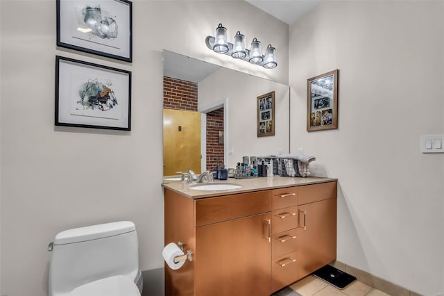 bathroom featuring toilet, vanity, and tile patterned flooring