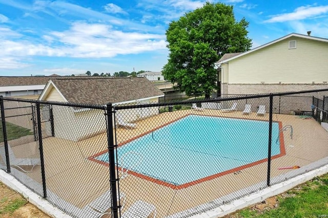 view of pool featuring fence