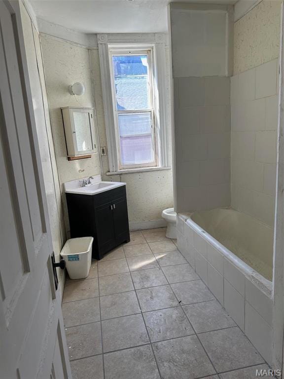 2643 Gravois Ave, Saint Louis, MO 63118 - bathroom with vanity, tile patterned flooring, and toilet
