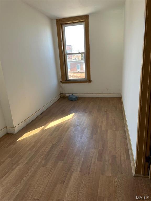 2643 Gravois Ave, Saint Louis, MO 63118 - spare room with wood finished floors and baseboards