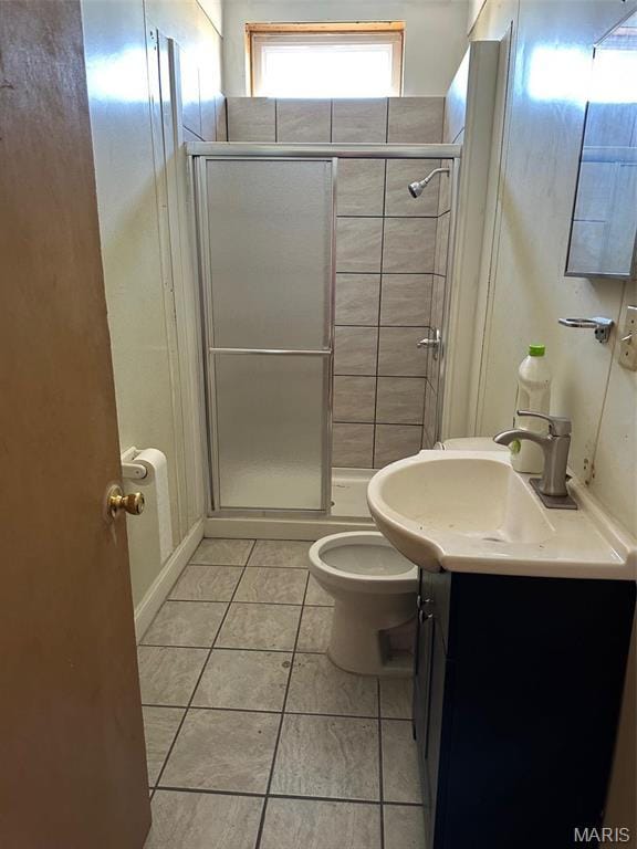 2643 Gravois Ave, Saint Louis, MO 63118 - bathroom featuring a shower stall, tile patterned flooring, vanity, and toilet