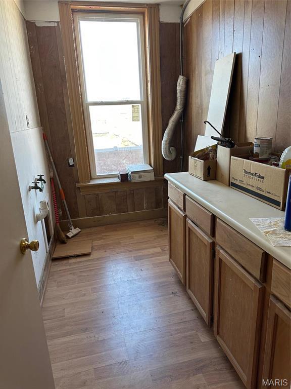 2643 Gravois Ave, Saint Louis, MO 63118 - bathroom featuring wood finished floors and wood walls