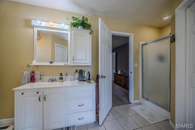 735 Dale Ln, Richland, MO 65556 - bathroom with vanity, a stall shower, tile patterned flooring, and baseboards