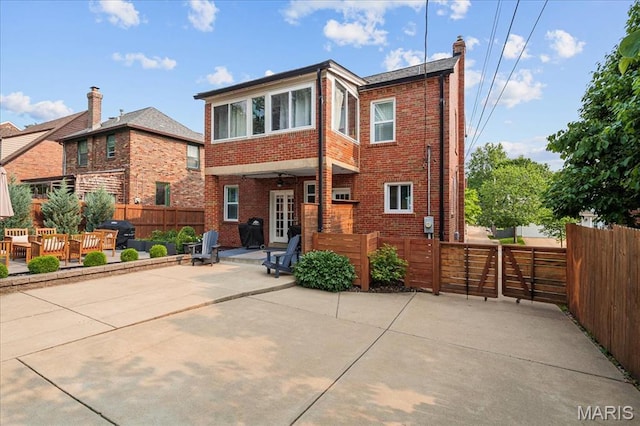 7334 Chamberlain Ave, Saint Louis, MO 63130 - view of front facade with brick siding, a patio, and a chimney