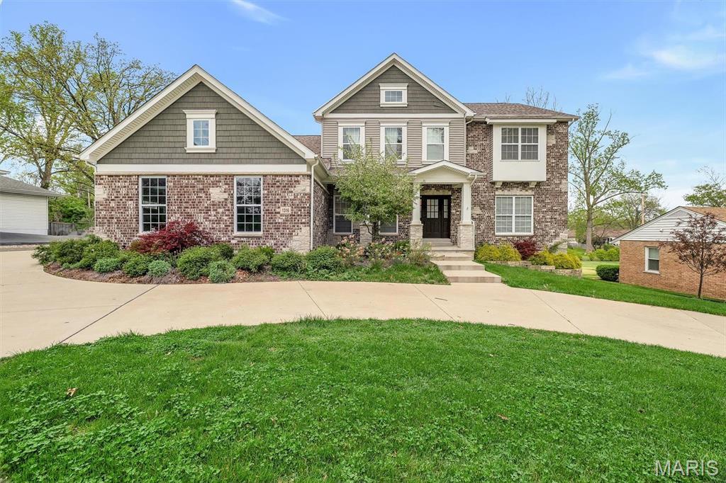 1316 Bopp Rd, Saint Louis, MO 63131 - craftsman house featuring a front lawn and brick siding