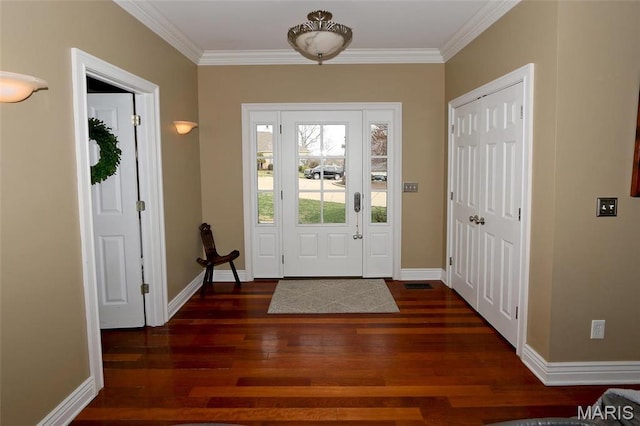 589 Wetherby Terrace Dr, Ballwin, MO 63021 - entryway with dark wood-style flooring, crown molding, and baseboards