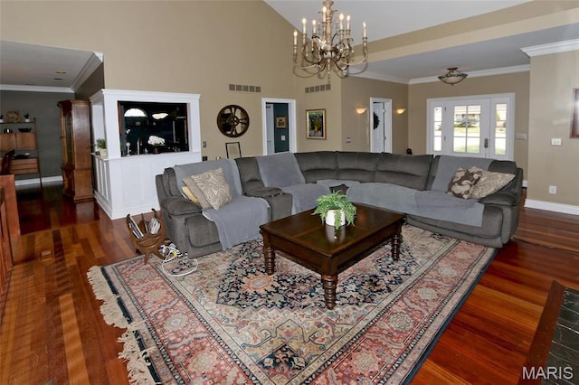 589 Wetherby Terrace Dr, Ballwin, MO 63021 - living room with a chandelier, wood finished floors, baseboards, crown molding, and lofted ceiling