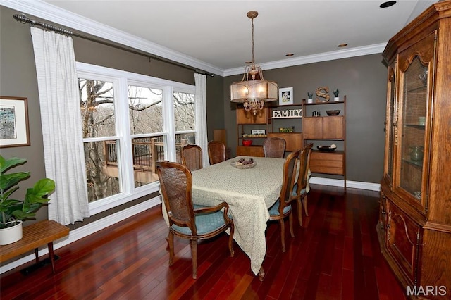 589 Wetherby Terrace Dr, Ballwin, MO 63021 - dining area with dark wood-type flooring, baseboards, and crown molding