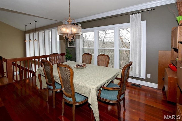 589 Wetherby Terrace Dr, Ballwin, MO 63021 - dining room featuring a chandelier, hardwood / wood-style floors, baseboards, and crown molding