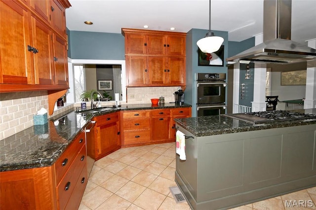 589 Wetherby Terrace Dr, Ballwin, MO 63021 - kitchen featuring island range hood, stainless steel appliances, a sink, brown cabinetry, and backsplash
