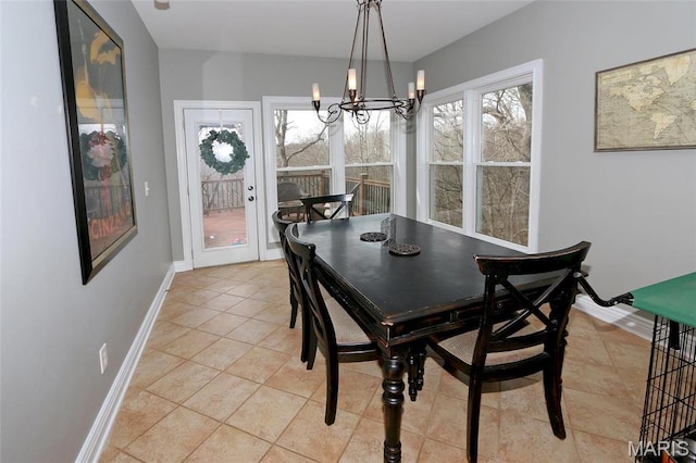 589 Wetherby Terrace Dr, Ballwin, MO 63021 - dining area with a chandelier, baseboards, and light tile patterned floors