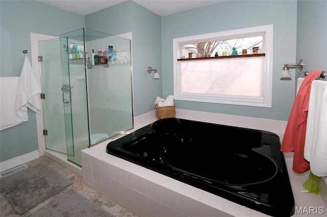 589 Wetherby Terrace Dr, Ballwin, MO 63021 - bathroom with a tub with jets, a stall shower, and baseboards