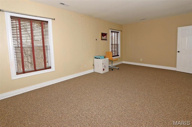 589 Wetherby Terrace Dr, Ballwin, MO 63021 - empty room with healthy amount of natural light, carpet, and baseboards