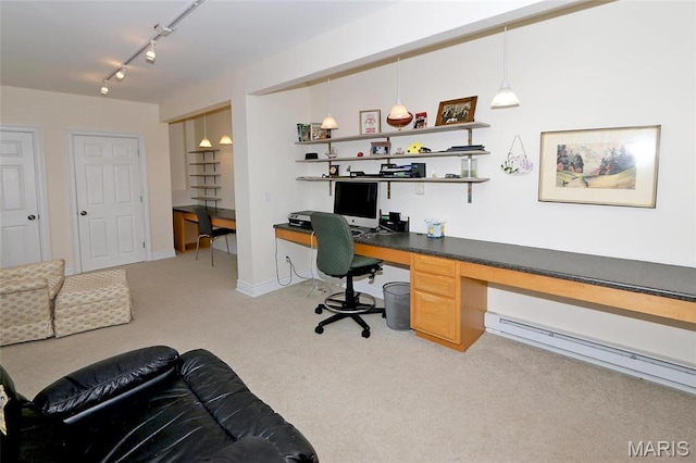 589 Wetherby Terrace Dr, Ballwin, MO 63021 - office area with light colored carpet, built in desk, a baseboard radiator, rail lighting, and baseboards