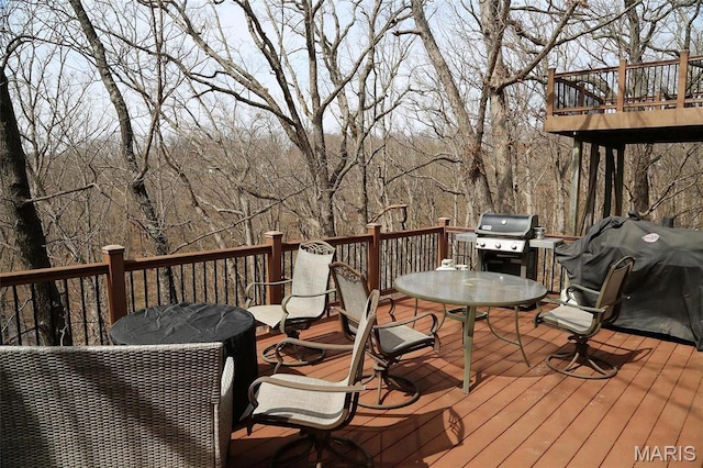 589 Wetherby Terrace Dr, Ballwin, MO 63021 - wooden terrace with outdoor dining area and grilling area