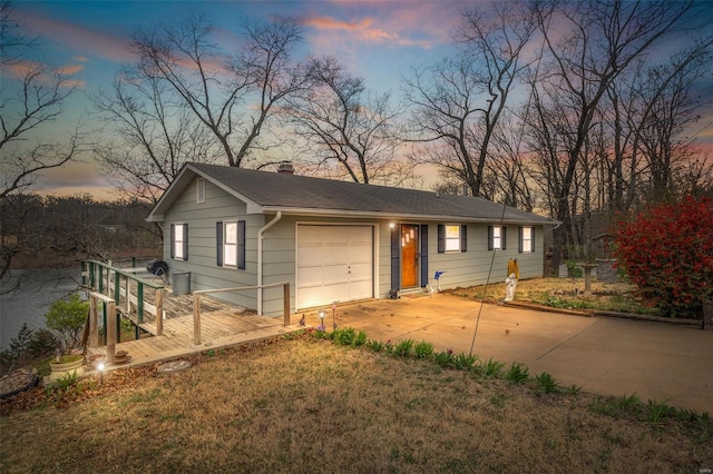 9449 E Lake View Dr, Bonne Terre, MO 63628 - ranch-style house featuring concrete driveway, a chimney, and a yard