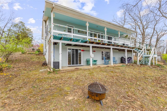 9449 E Lake View Dr, Bonne Terre, MO 63628 - back of property featuring an outdoor fire pit, a deck, stairway, and a patio area