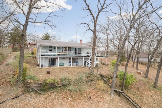 9449 E Lake View Dr, Bonne Terre, MO 63628 - back of house with a chimney, a wooden deck, and stairs