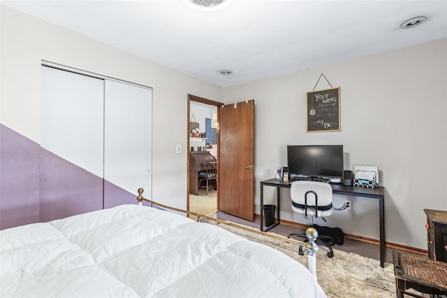 9449 E Lake View Dr, Bonne Terre, MO 63628 - bedroom featuring an office area, a closet, and baseboards