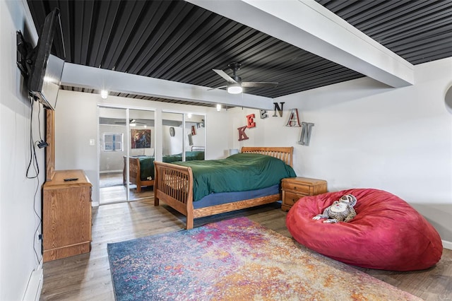 9449 E Lake View Dr, Bonne Terre, MO 63628 - bedroom featuring wood finished floors, beam ceiling, and a ceiling fan